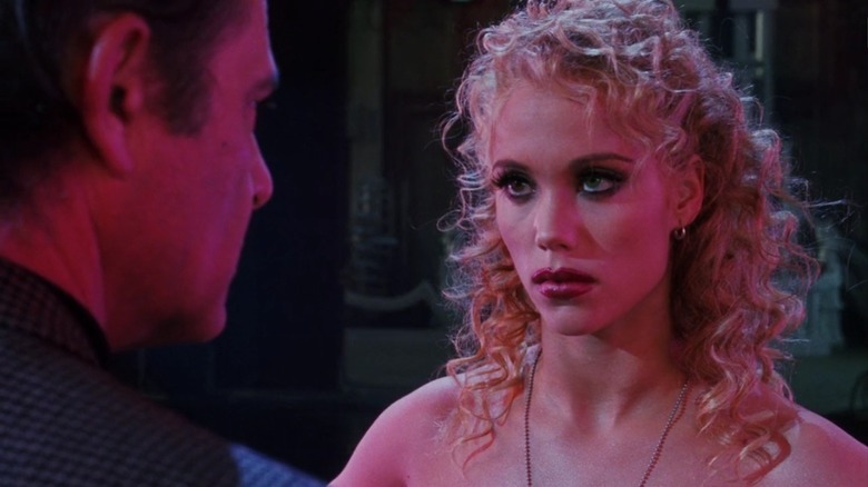 Elizabeth Berkley in Showgirls looking angry