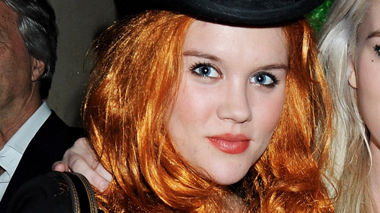 Emerald Fennell wearing an orange wig