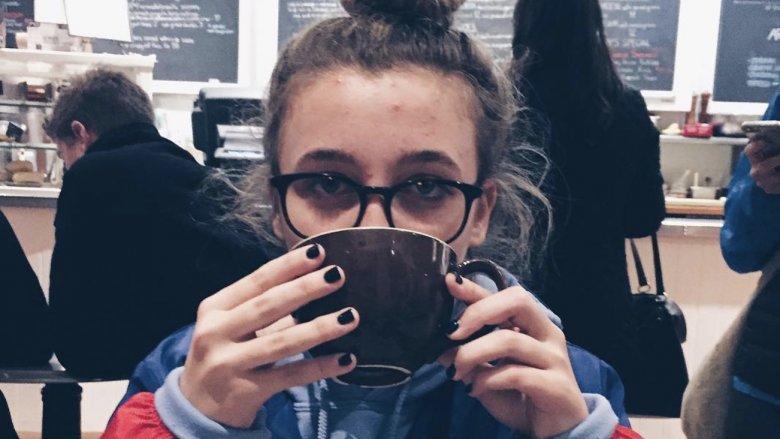 Emma Chamberlain drinking coffee