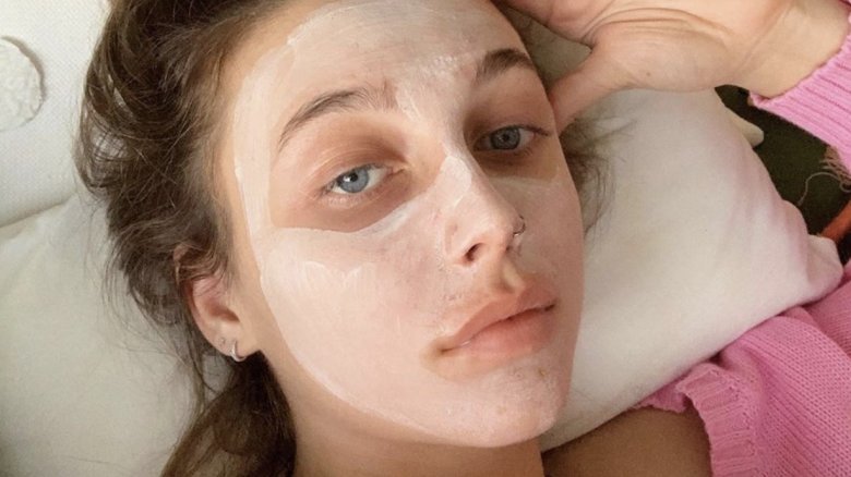 Emma Chamberlain with a face mask on