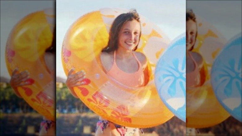 young Emma Chamberlain swimming