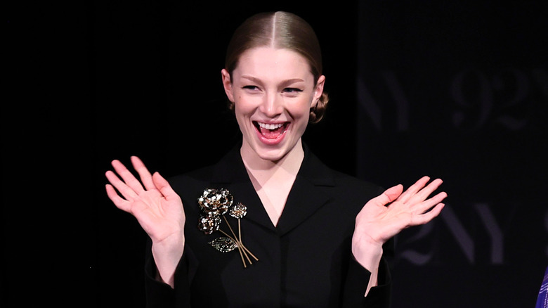 Hunter Schafer waving her hands excitedly