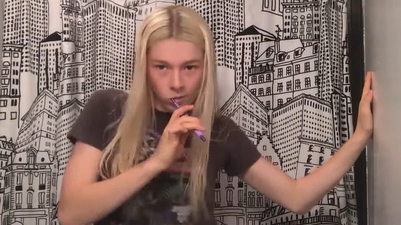 Hunter Schafer brushing her teeth