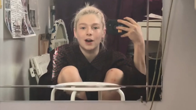 Hunter Schafer filming herself in a mirror