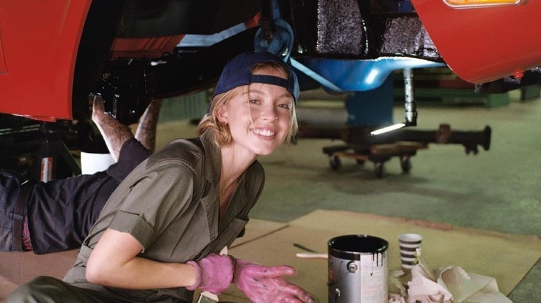 Sydney Sweeney fixing a car