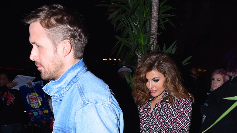 Ryan Gosling and Eva Mendes walking at night