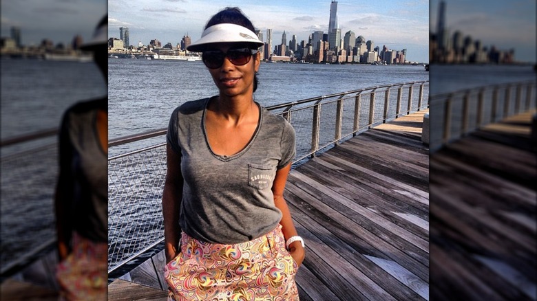 Harris Faulkner wearing sunglasses and visor at the Hoboken, New Jersey boardwalk