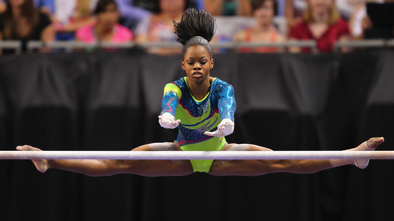 Gabby Douglas performing on the bars