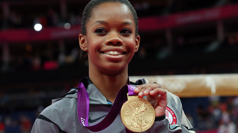 Gabby Douglas showing off her gold medal