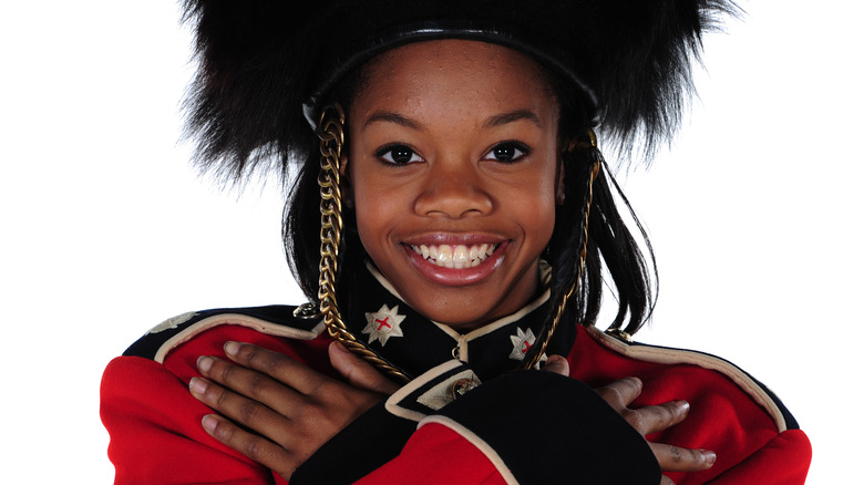 Gabby Douglas in costume smiling