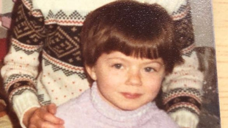 Geri Halliwell Horner as a child smiling 