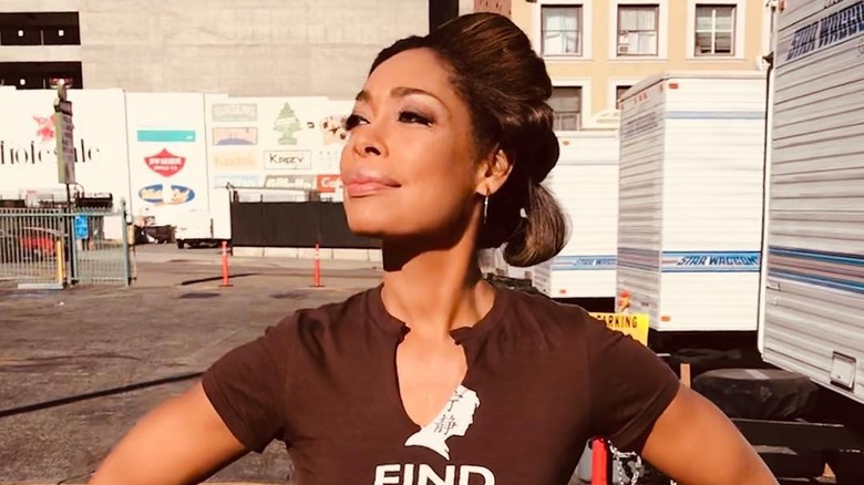 Gina Torres smiling on set