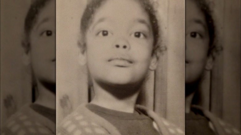 Gina Torres as a child posing