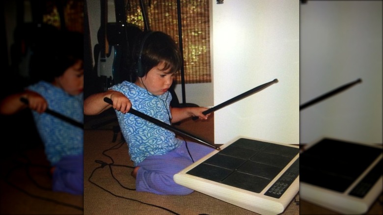 Gracie Abrams banging on drum pad