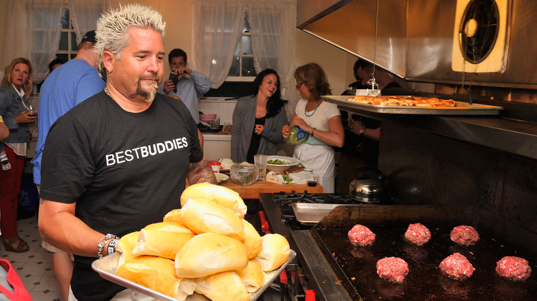 Guy Fieri cooking at an event