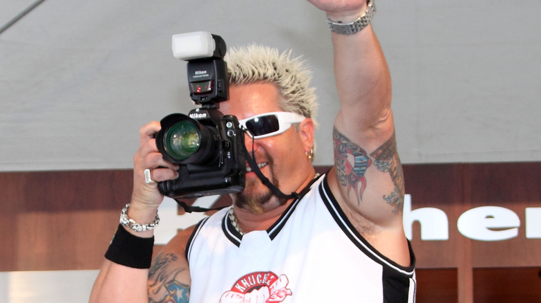 Guy Fieri taking photos in 2009