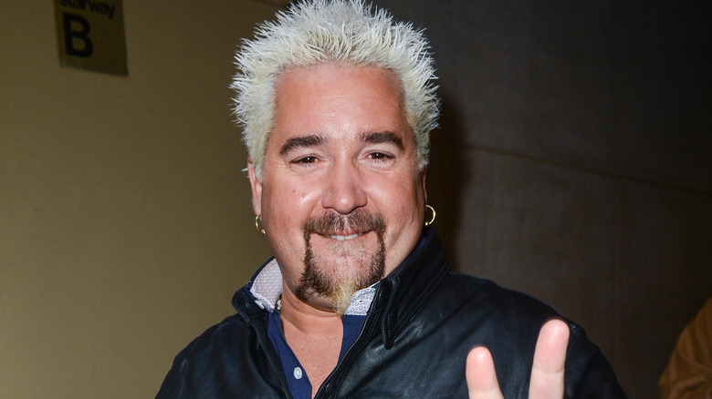 Guy Fieri with two fingers up