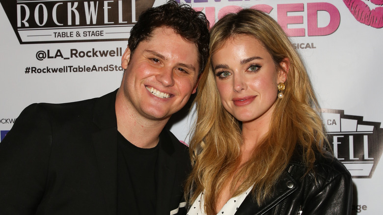 Matt Shively and Ashley Newbrough posing for a photo with their heads close together