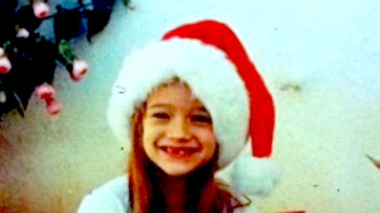 Hunter King as a kid in a Santa hat