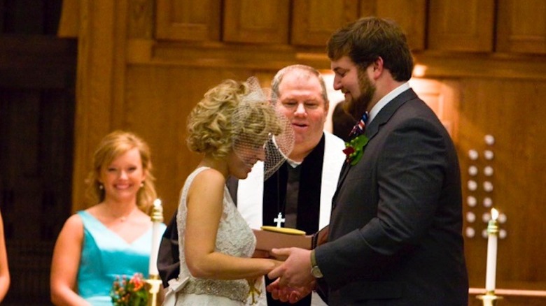 Erin and Ben Napier facing each other at their wedding