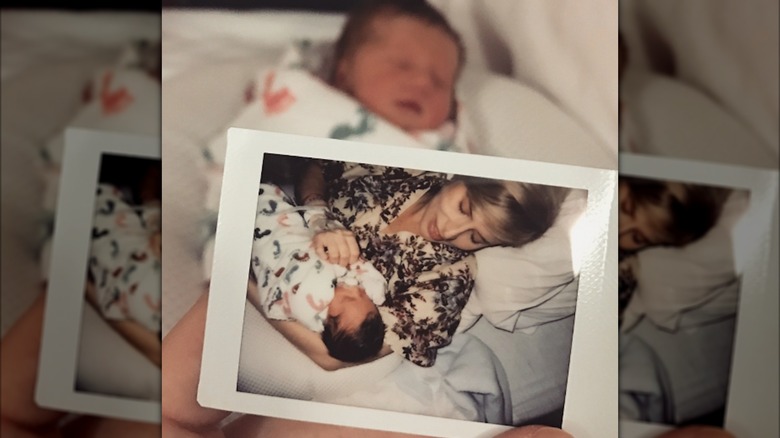 Erin Napier holding a newborn baby