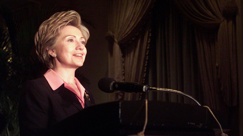 Hillary Clinton at the mic in 2002 