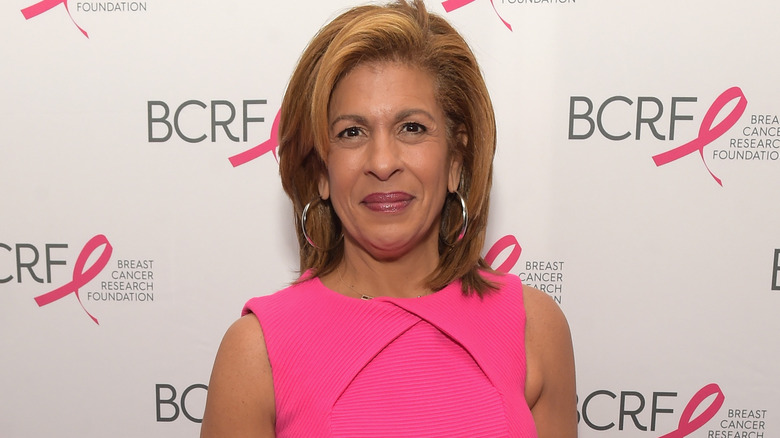 Hoda Kotb breast cancers survivor and activist standing on the BCRF pink carpet