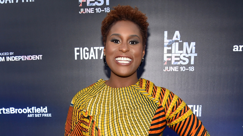 Issa Rae smiling at a screening of Love and Basketball