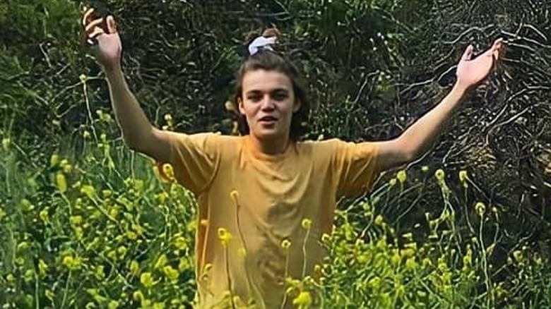 Jack Depp with arms out