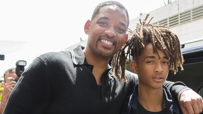 Will and Jaden Smith posing for a photo