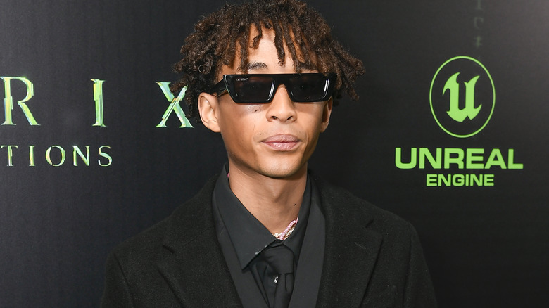 Jaden Smith posing for a photo with sunglasses on