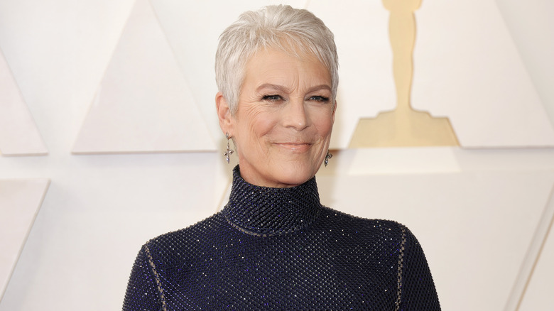 Jamie Lee Curtis posing on the Oscars red carpet in 2022