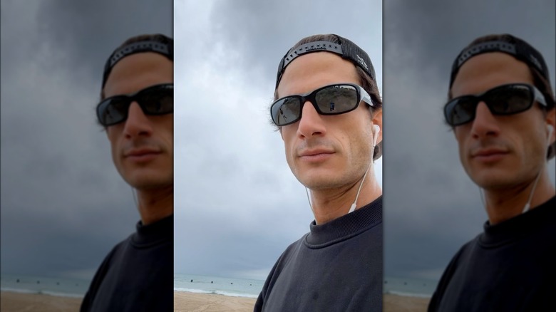 Jack Schlossberg wearing sunglasses at the beach