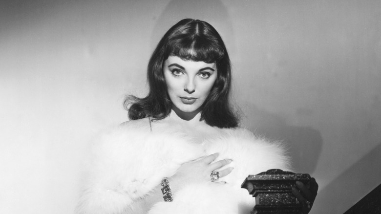 Joan Collins wearing fur