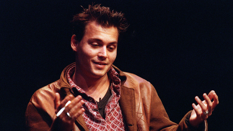 Johnny Depp speaking on stage, 1995