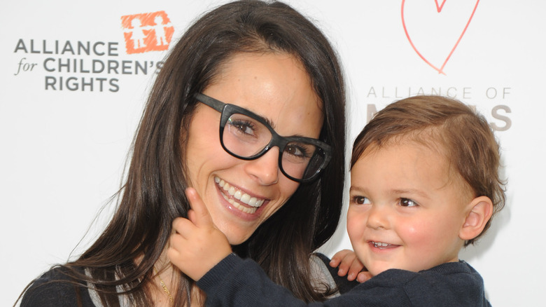 Jordana Brewster holding son