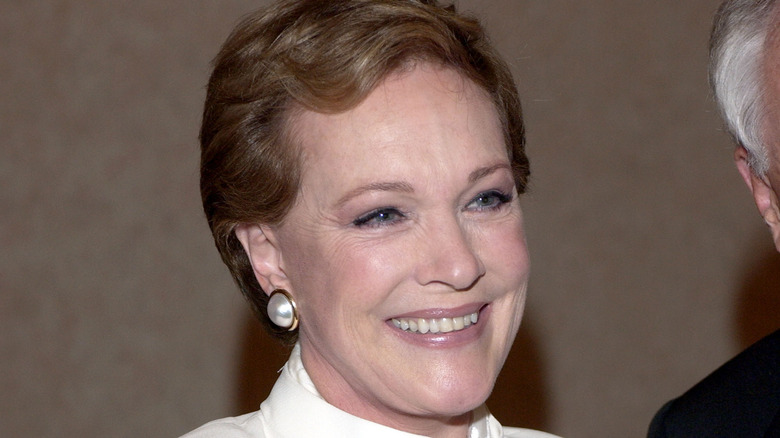 Julie Andrews in a white coat