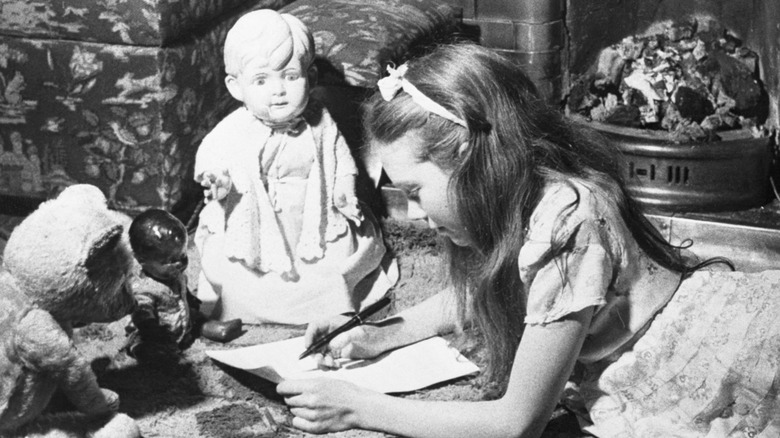 Young Julie Andrews with her dolls