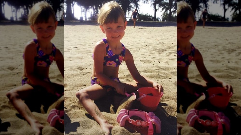 Karlie Kloss as a kid on the beach