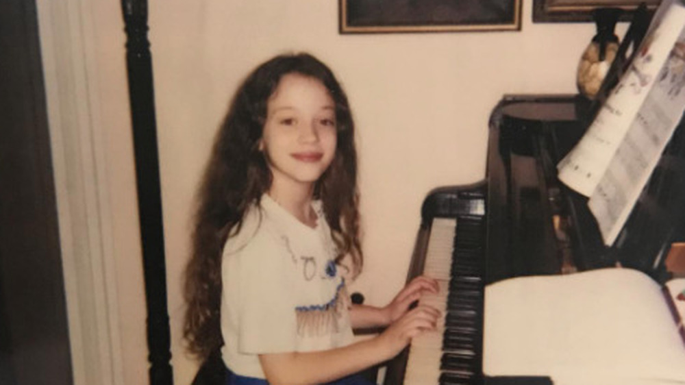 Kat Dennings as a child playing piano