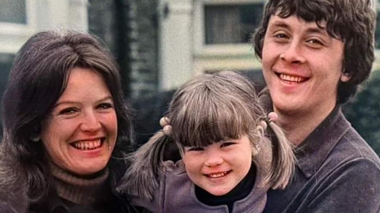 Judy Loe, Kate Beckinsale, and Richard Beckinsale smiling in a family photo