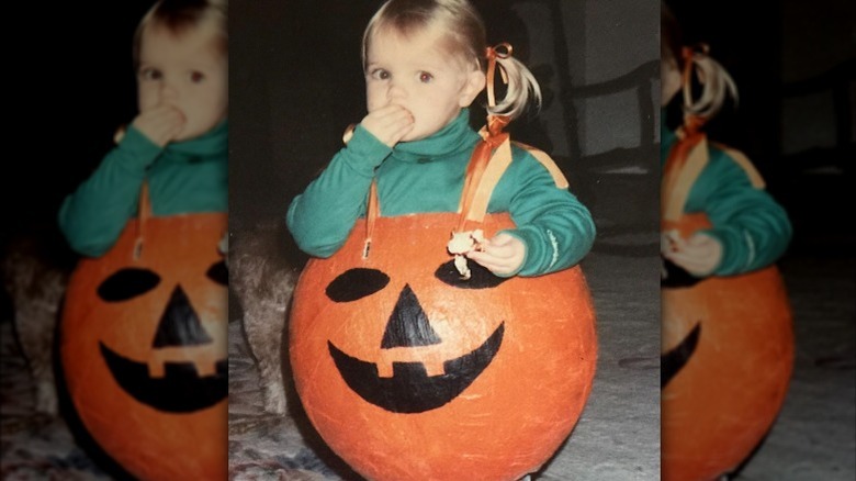 Kate Bosworth as a child dressed as a pumpkin