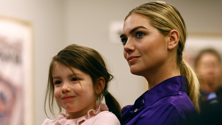 Kate Upton holding daughter Genevieve