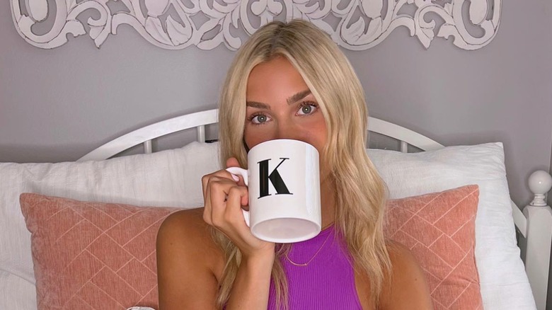 Katie Feeney drinking from a mug