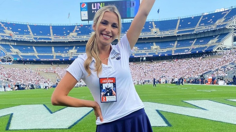 Katie Feeney smiling on a football field