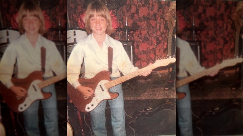 A young Keith Urban playing guitar