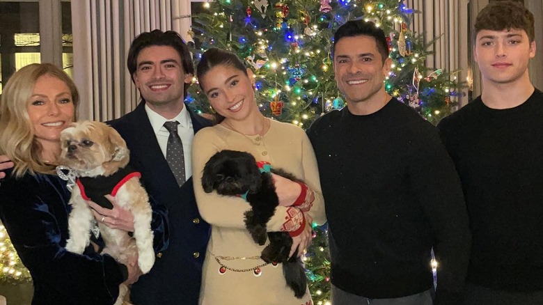 Mark Consuelos, Kelly Ripa, kids, and dogs Christmas photo