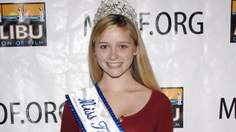 Greer Grammer with pageant sash and crown