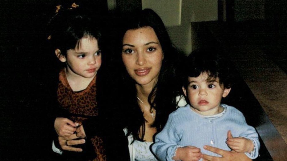 Kendall Jenner, Kim Kardashian, and Kylie Jenner in a throwback photo