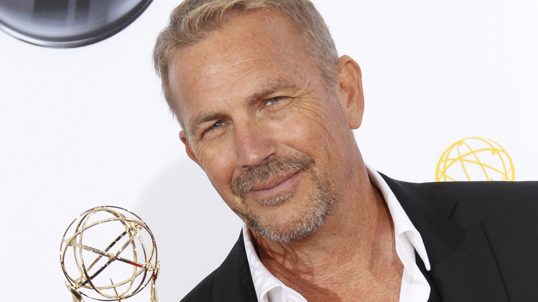 Kevin Costner slyly smiling at the Emmy's